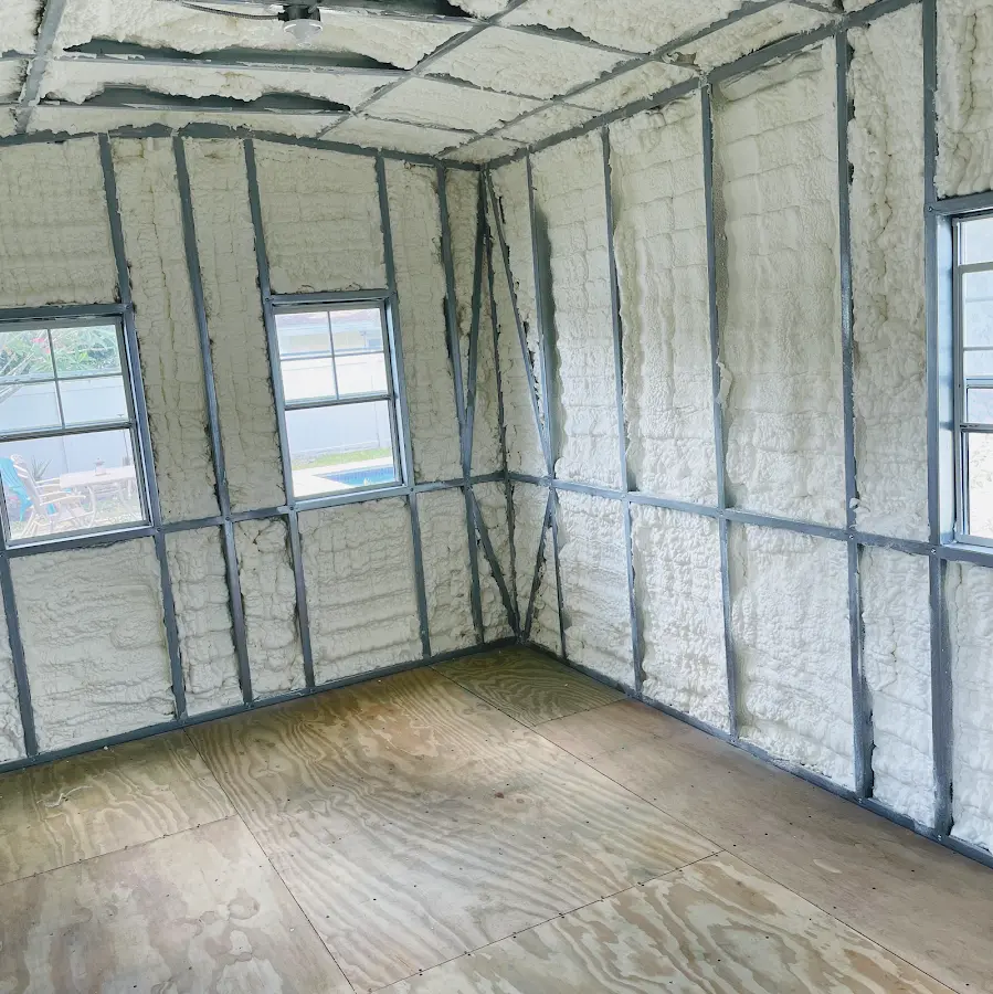 Closed-cell spray foam insulation applied to wall cavities in a residential project in Norwood
